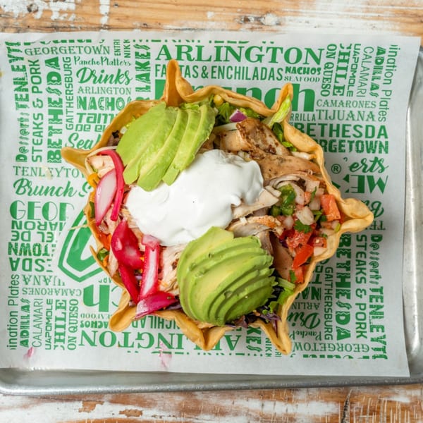 A Guapo's Cocina & Bar taco salad with chicken, avocado, sour cream, and pico de gallo.